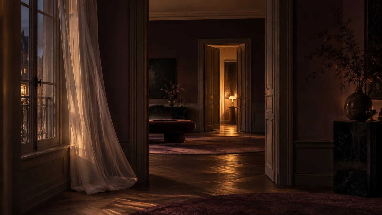 An empty, warmly lit interior seen through a series of open doorways, suggesting anticipation and a deliberately unfinished journey. An empty, warmly lit interior seen through a series of open doorways, suggesting anticipation and a deliberately unfinished journey.